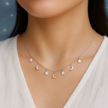 a young woman wearing a star and moon charm necklace