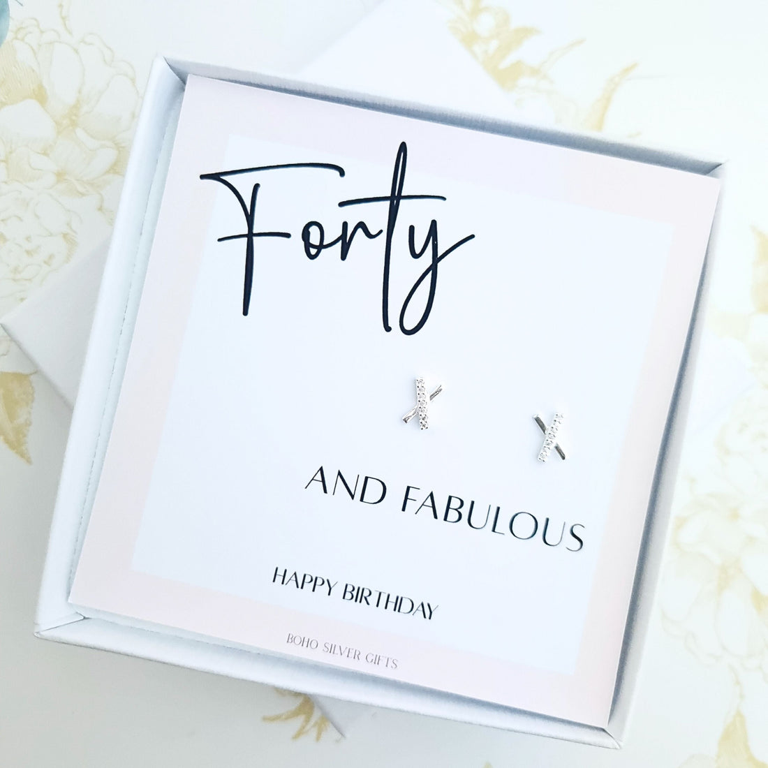 40th birthday gift set featuring minimalist X-shaped stud earrings on a happy birthday message card in gift box