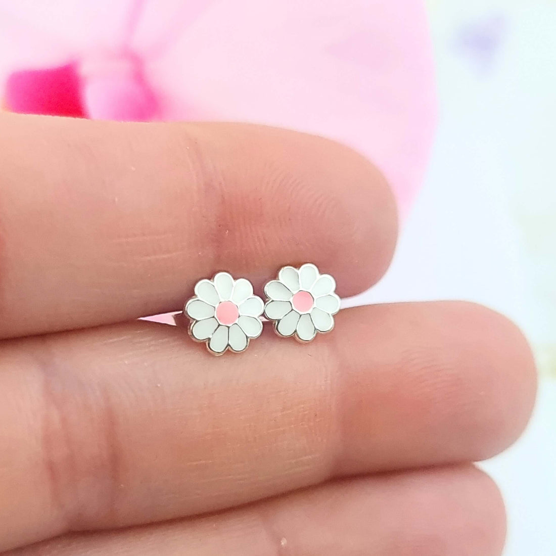 a pair of daisy flowers in sterling silver