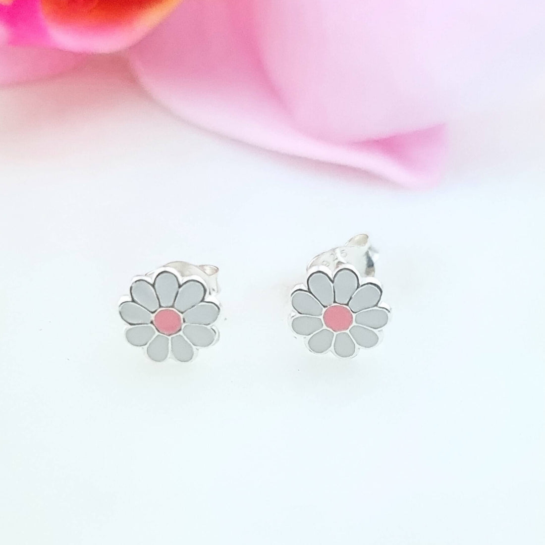 a pair of daisy flowers in sterling silver