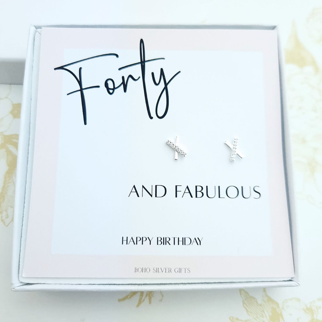40th birthday gift set featuring minimalist X-shaped stud earrings on a happy birthday message card in gift box