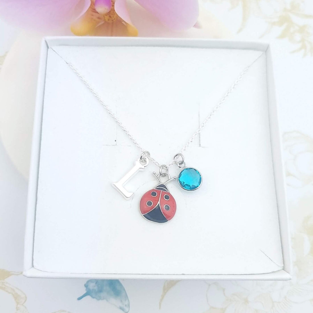 sterling silver ladybug necklace with initial and birthstone