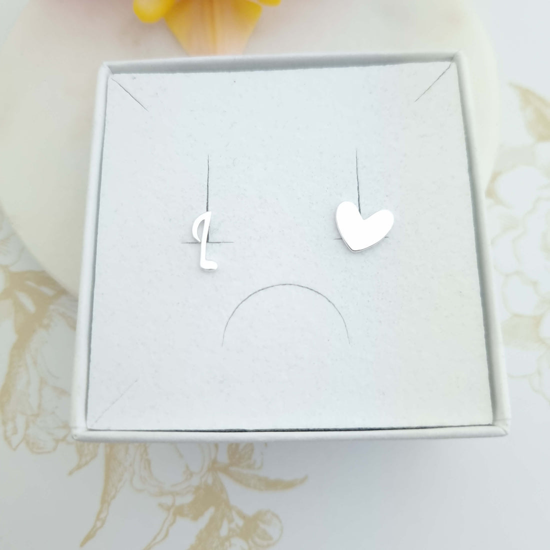 mismatched stud earrings in sterling silver - heart and music note