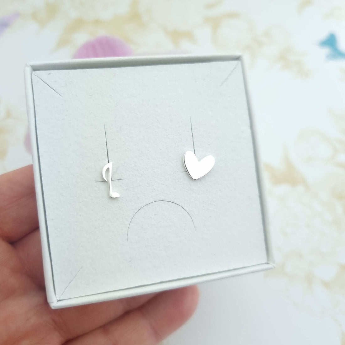 mismatched stud earrings in sterling silver - heart and music note