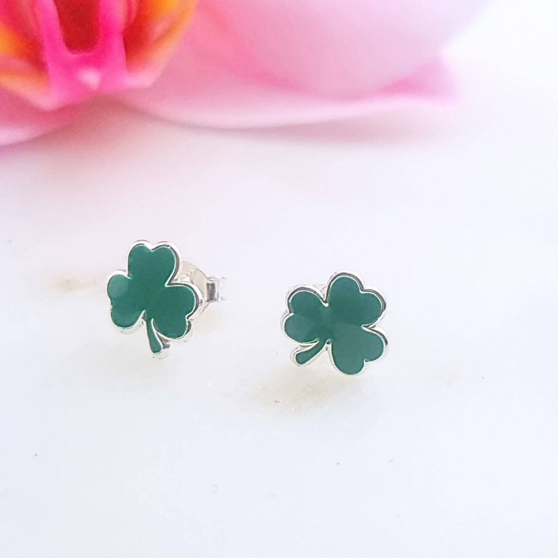 a pair of sterling silver shamrock studs