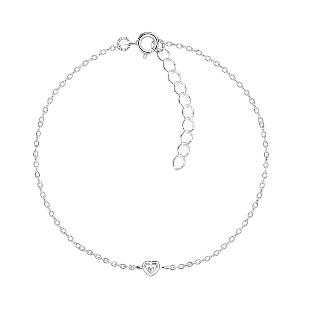 A delicate sterling silver bracelet featuring a small heart charm with a cubic zirconia stone at its centre. The bracelet has a 1mm chain with a 15cm + 3cm extension, displayed against a white background.