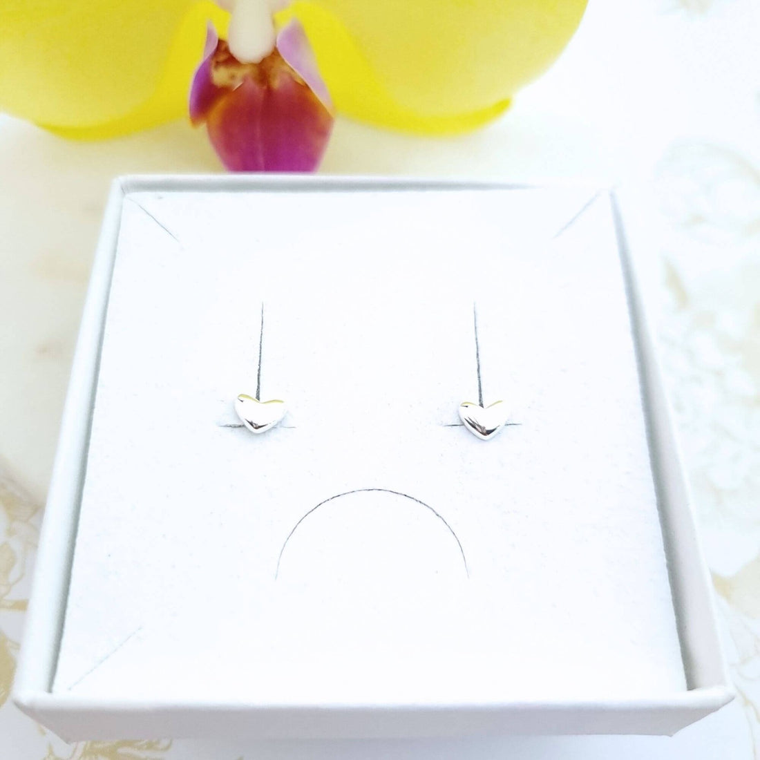 Tiny heart stud earrings in sterling silver