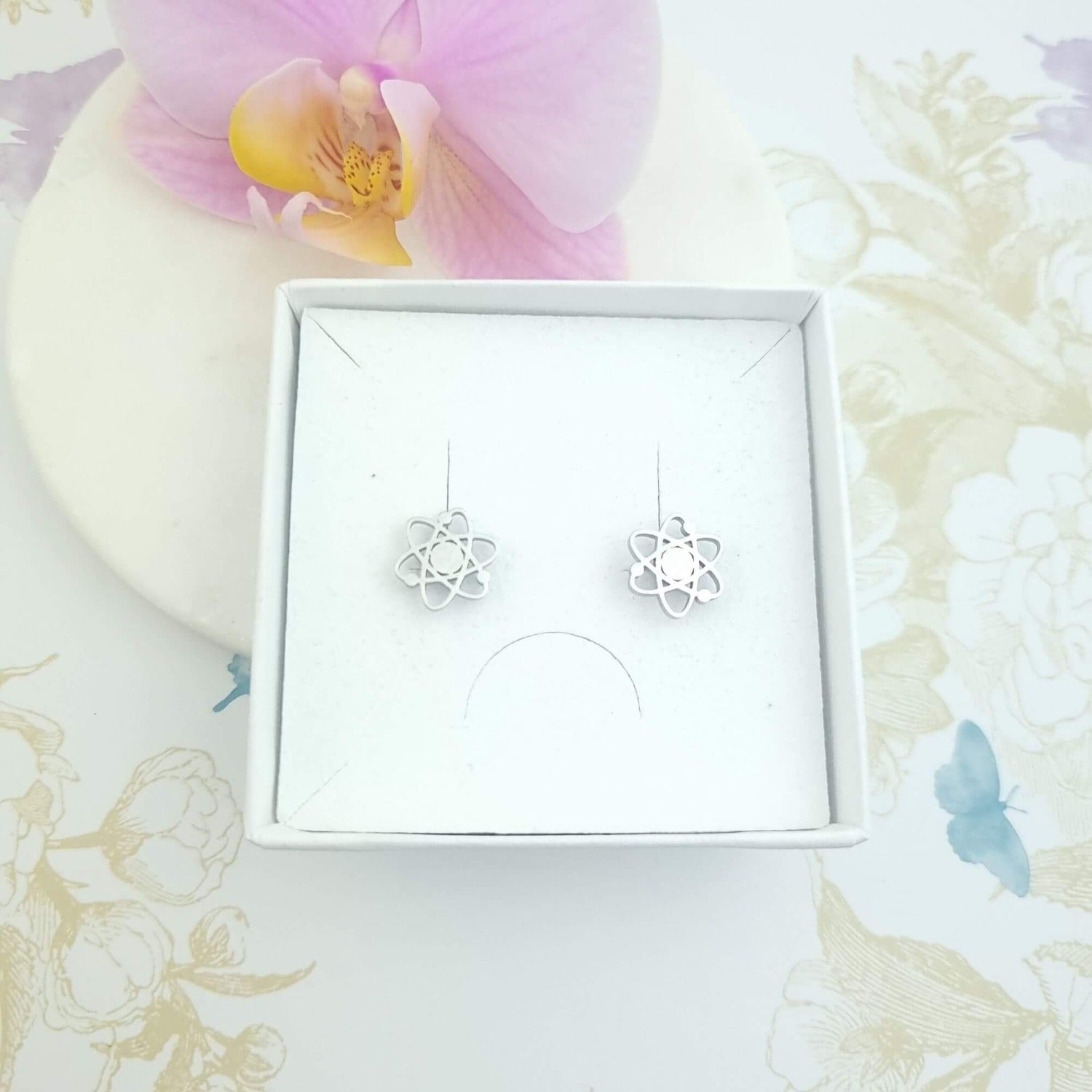 atom stud earrings in gift box