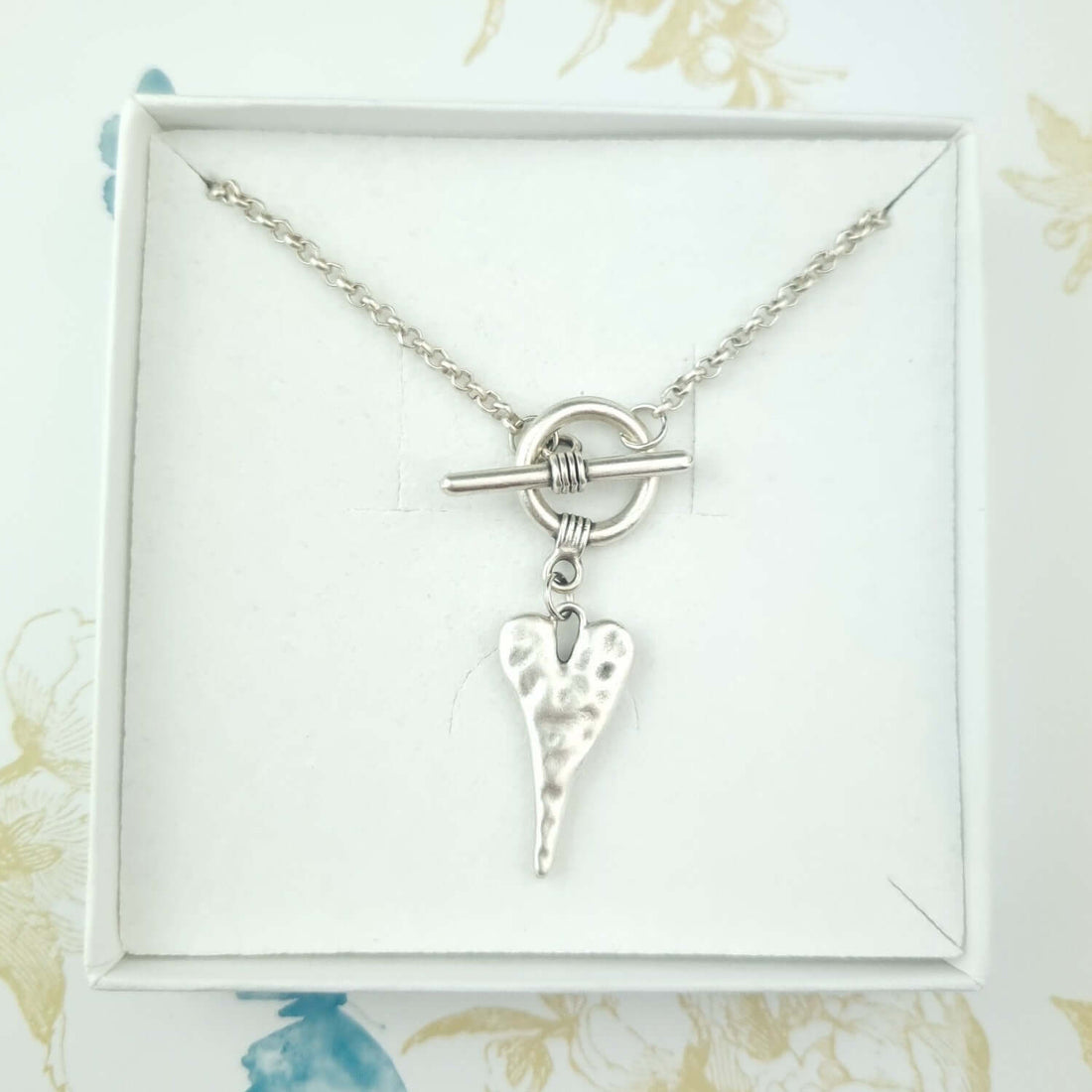 Silver chain link necklace with heart