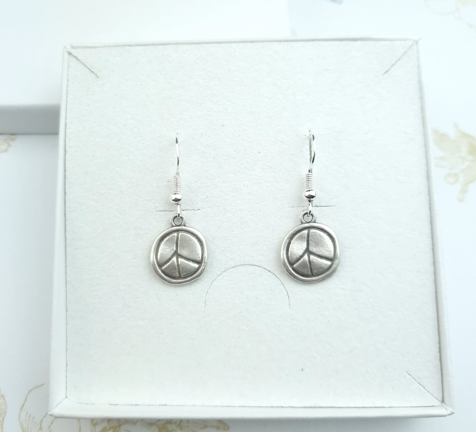 Dangle drop earrings peace sign