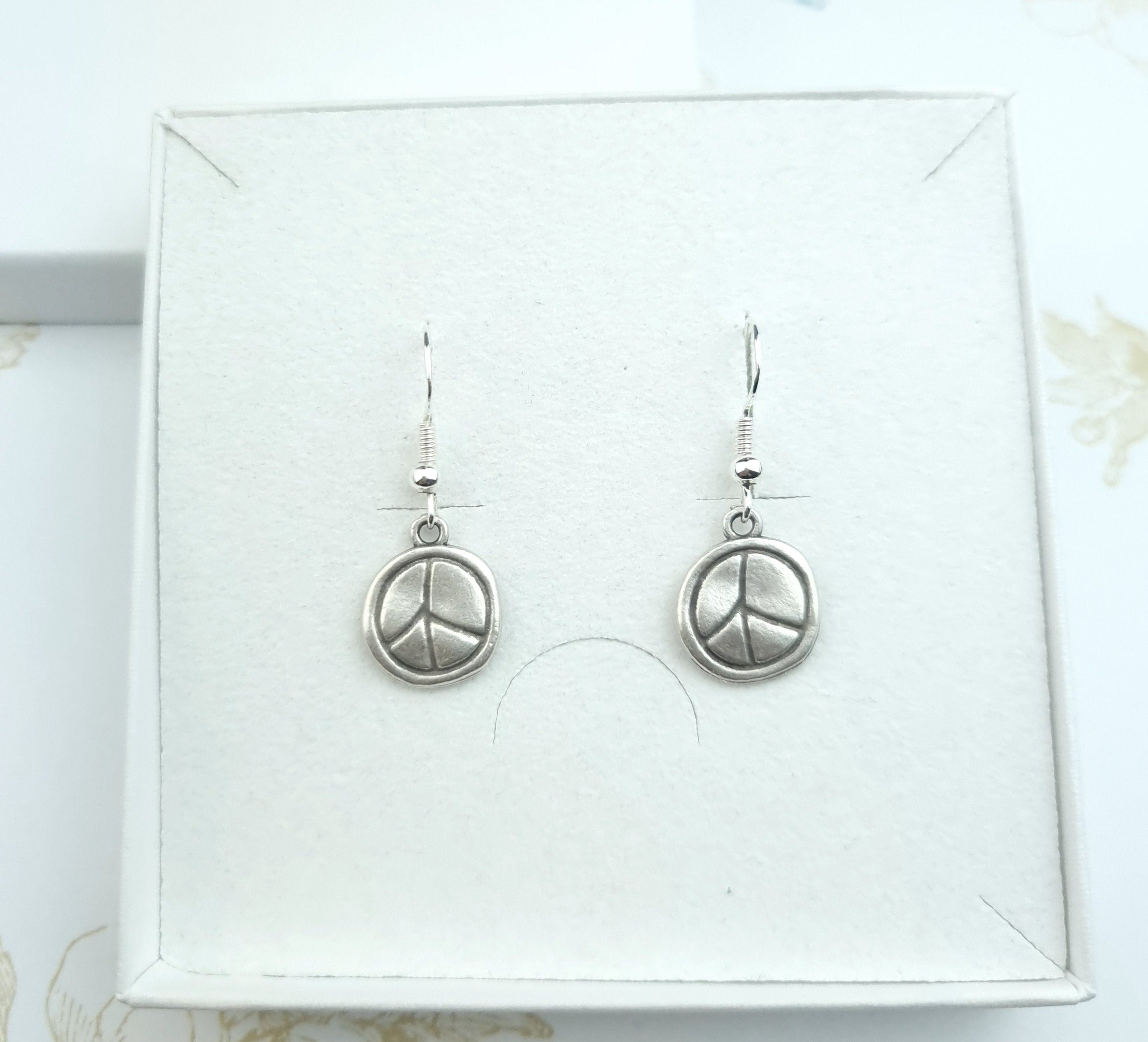 Dangle drop earrings peace sign