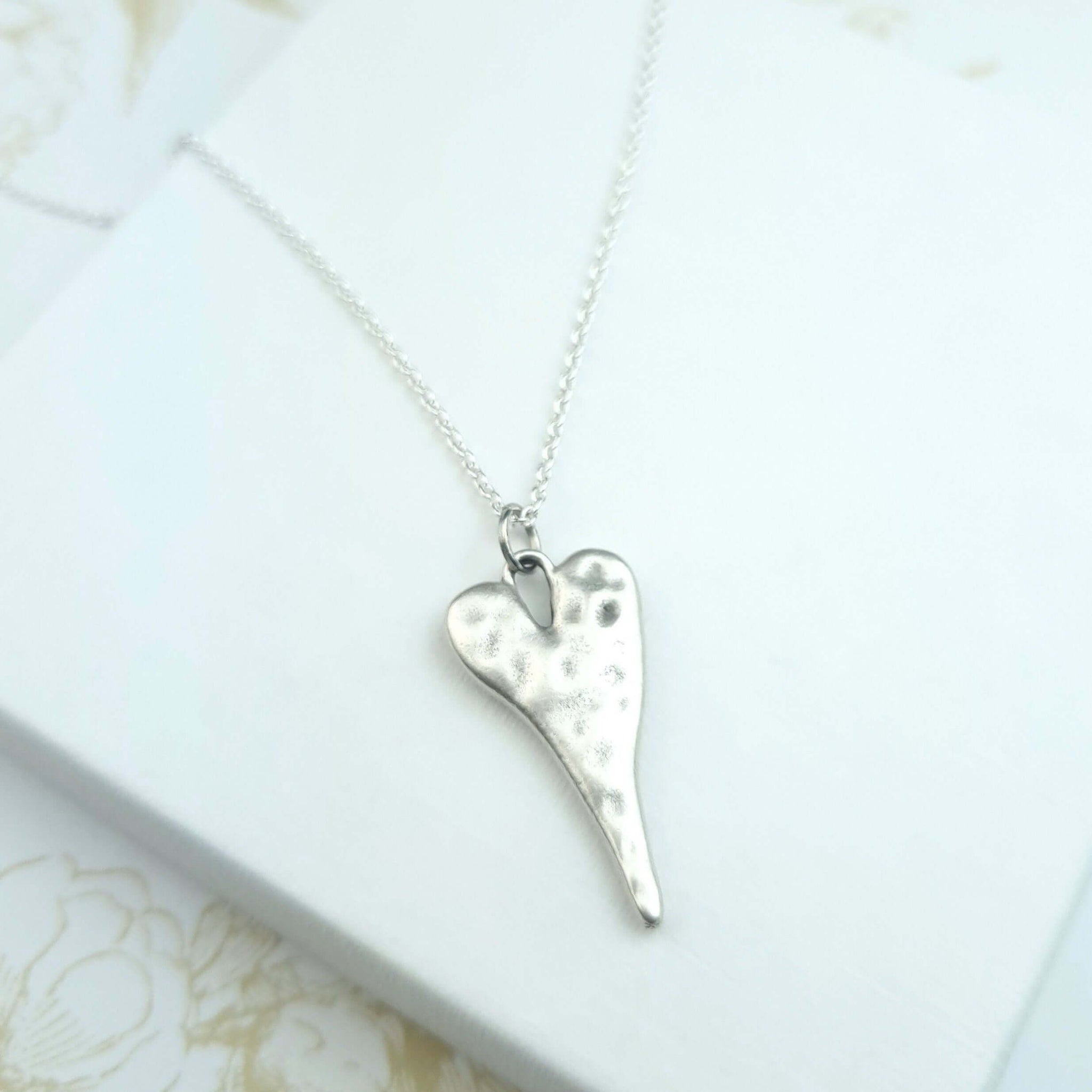sterling silver necklace with hammered heart pendant