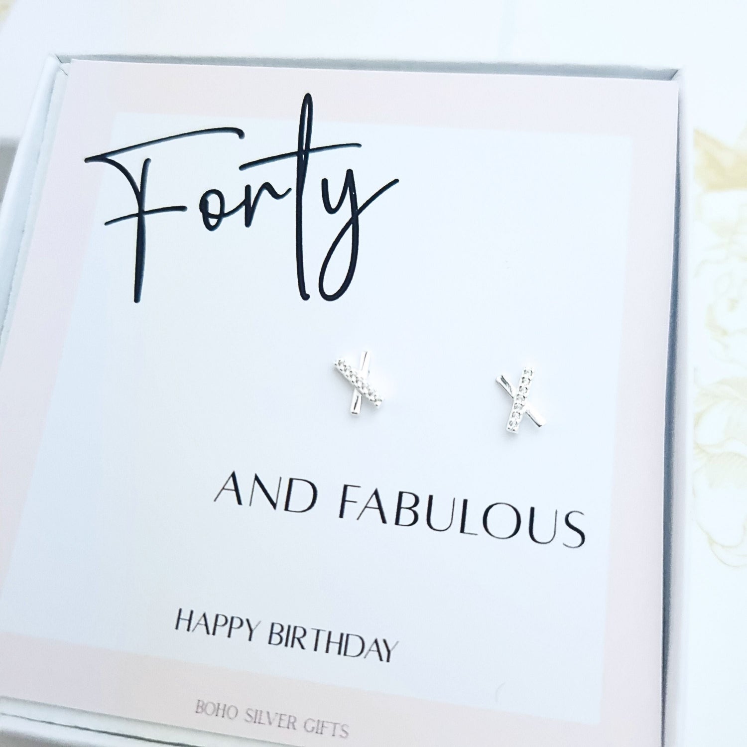 40th birthday gift set featuring minimalist X-shaped stud earrings on a happy birthday message card in gift box