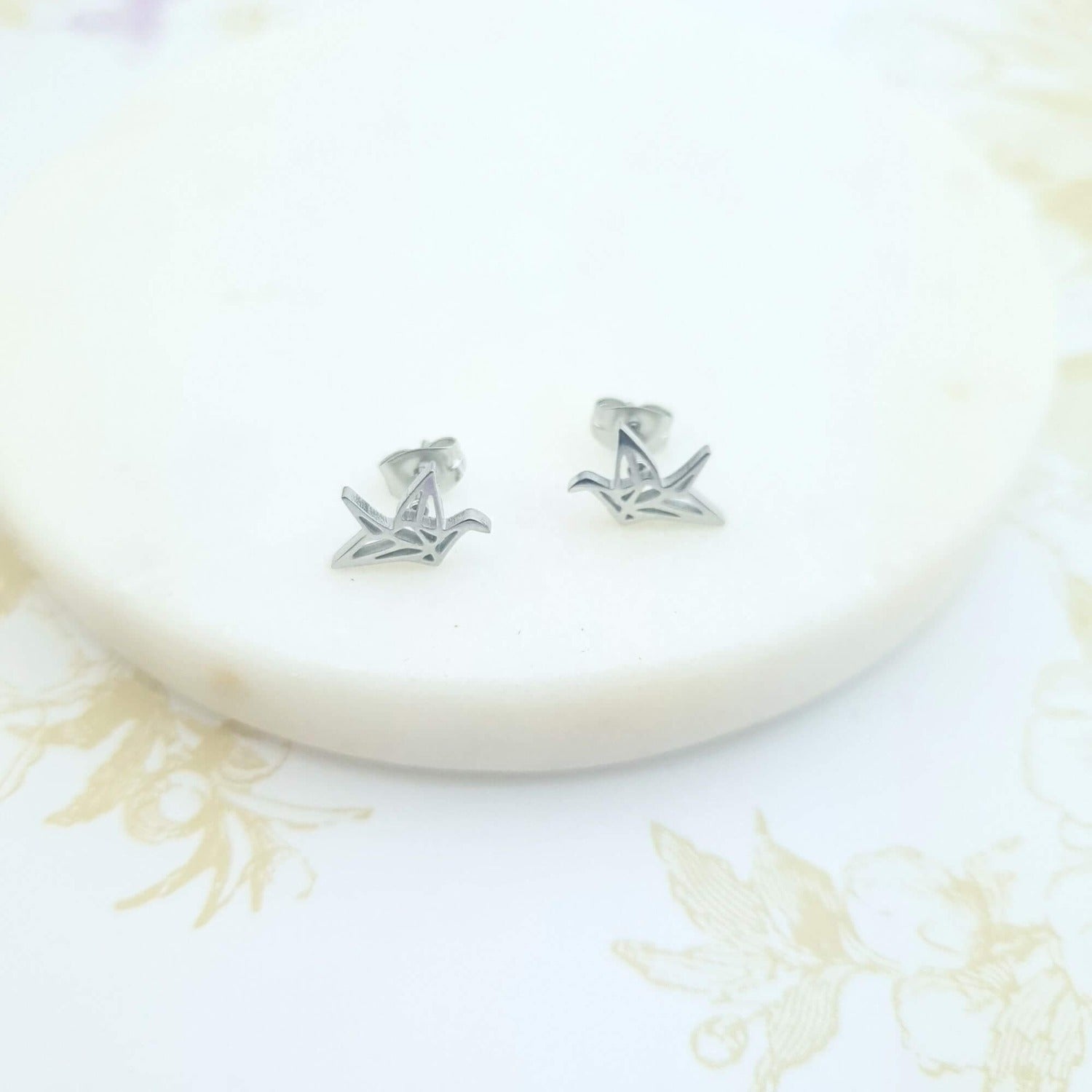 crane stud earrings