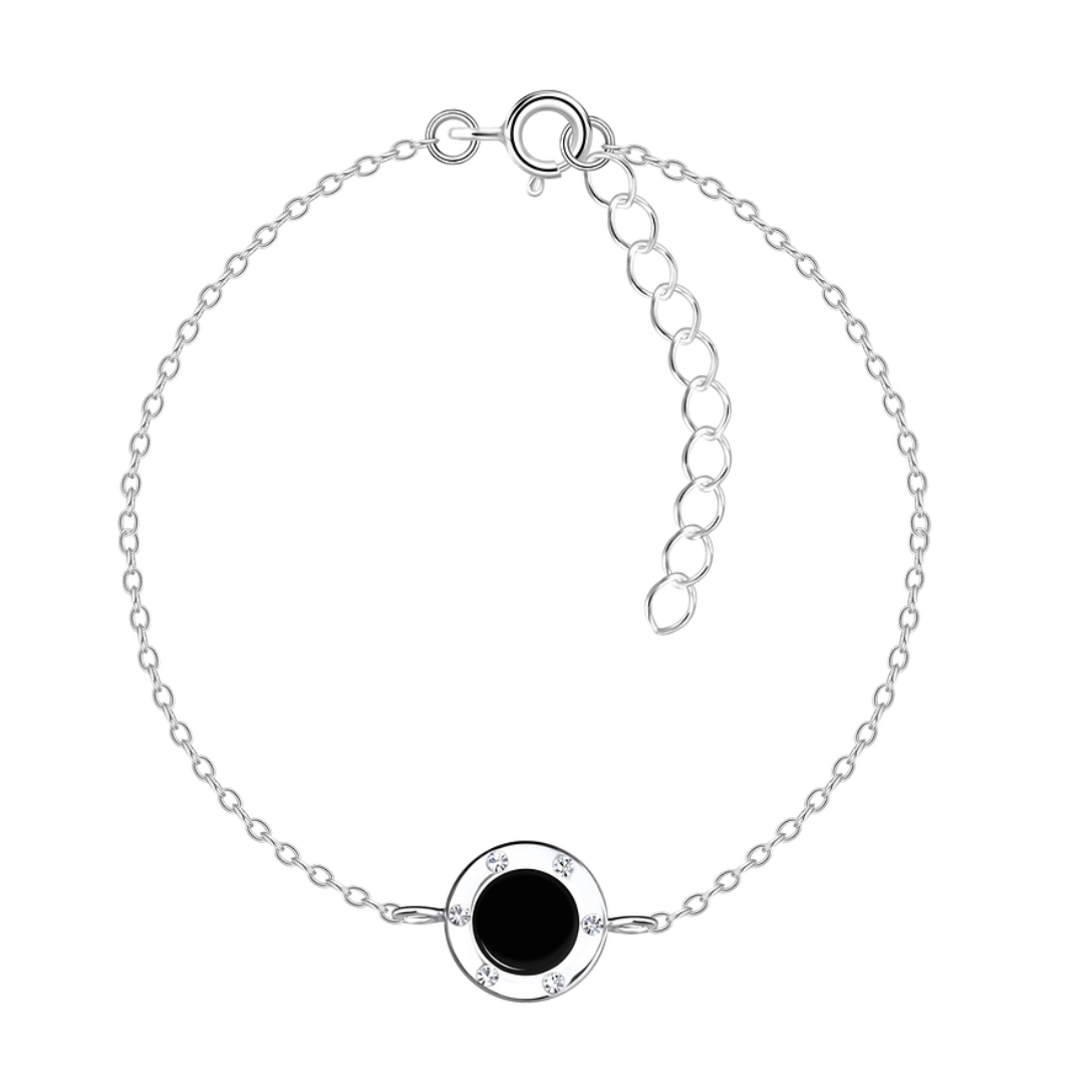 A sterling silver bracelet with a polished black onyx centrepiece, encased in a silver frame adorned with cubic zirconia stones, displayed on a delicate 1mm adjustable chain (15cm + 3cm extension).