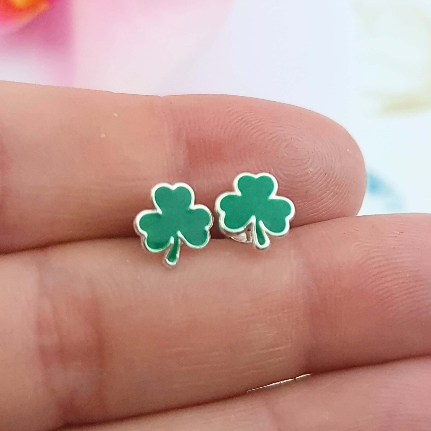 a pair of clover enamel sterling silver studs