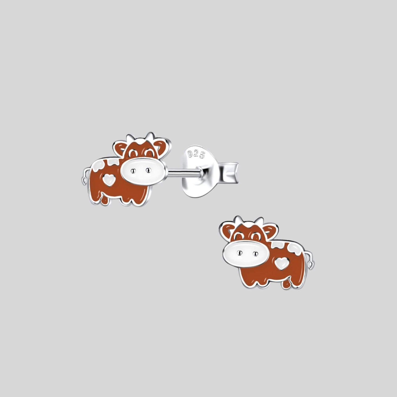 cow stud earrings close up