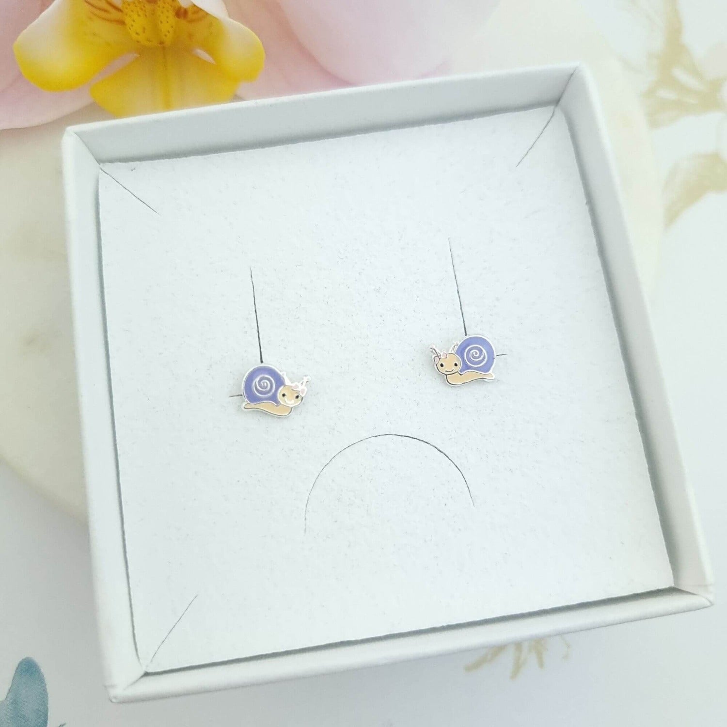 snail stud earrings in a gift box