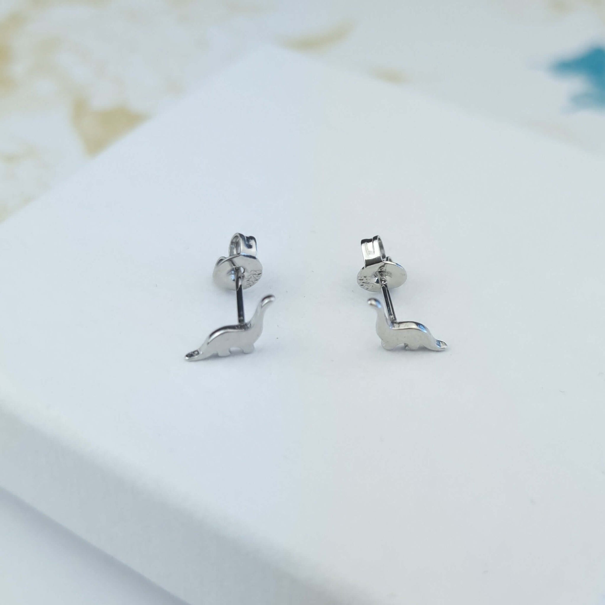 sterling silver tiny dinosaur stud earrings