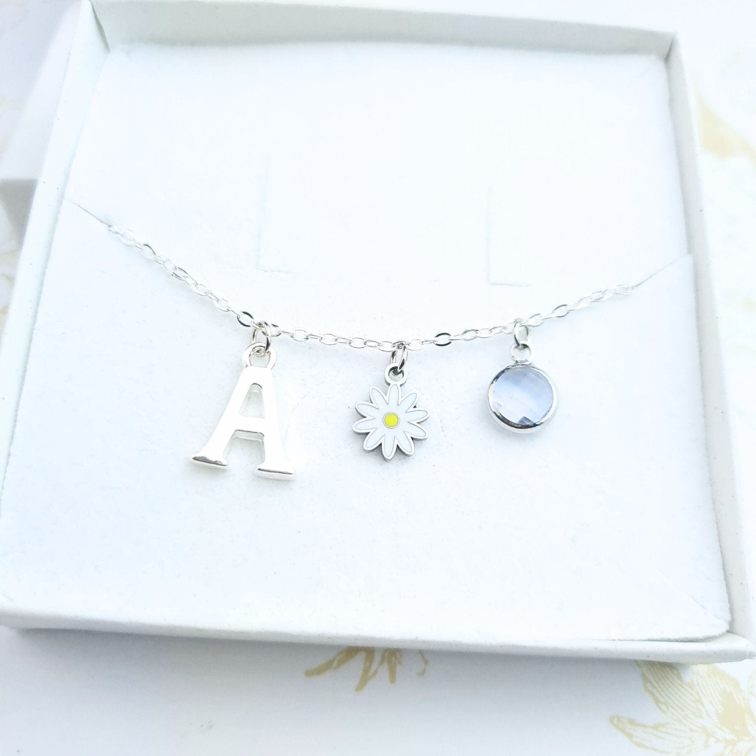 silver bracelet personalised with initial and birthstone