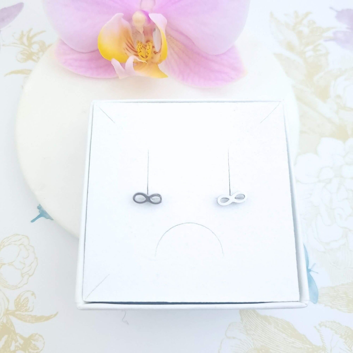 infinity stud earrings silver in a gift box
