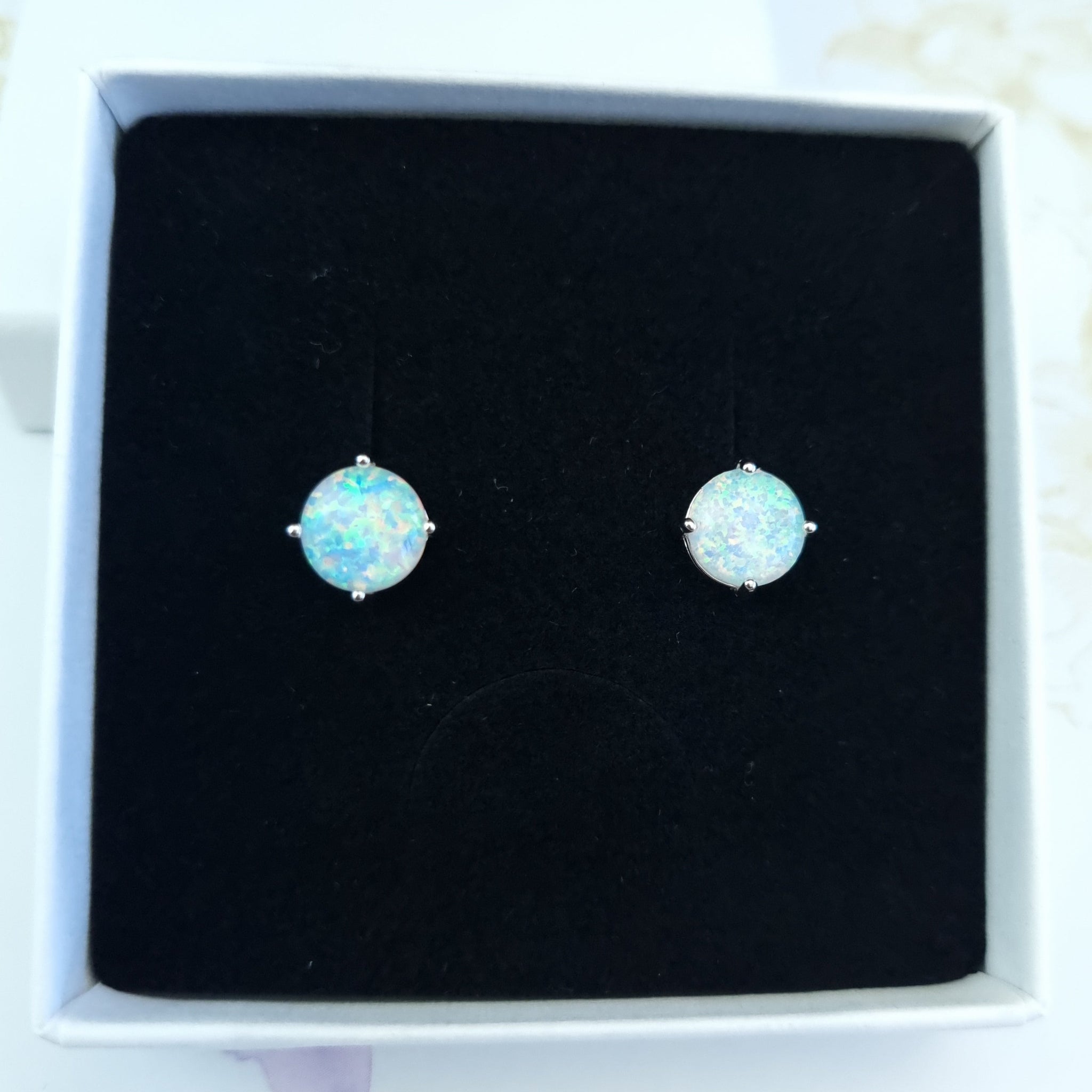 Opal stud earrings in sterling silver