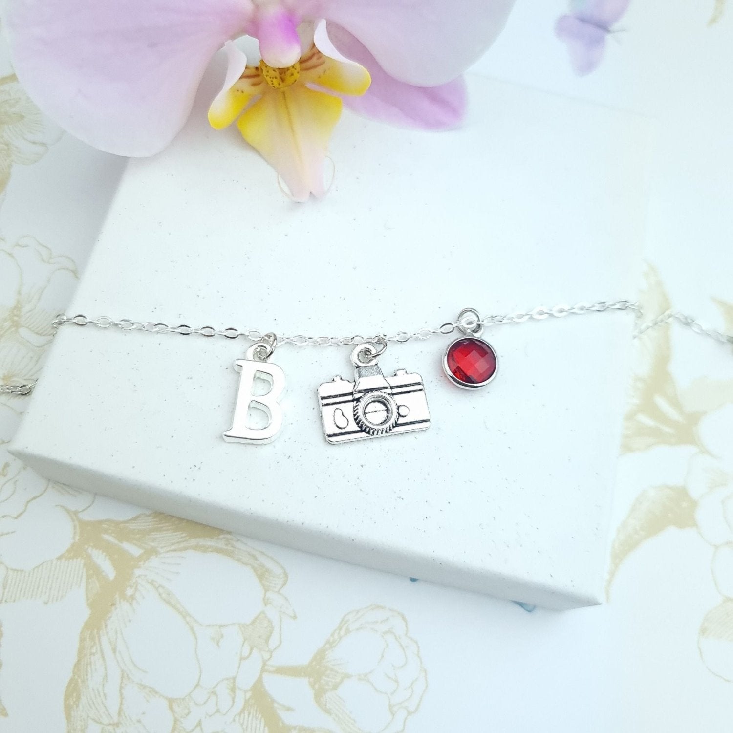 silver bracelet with camera charm