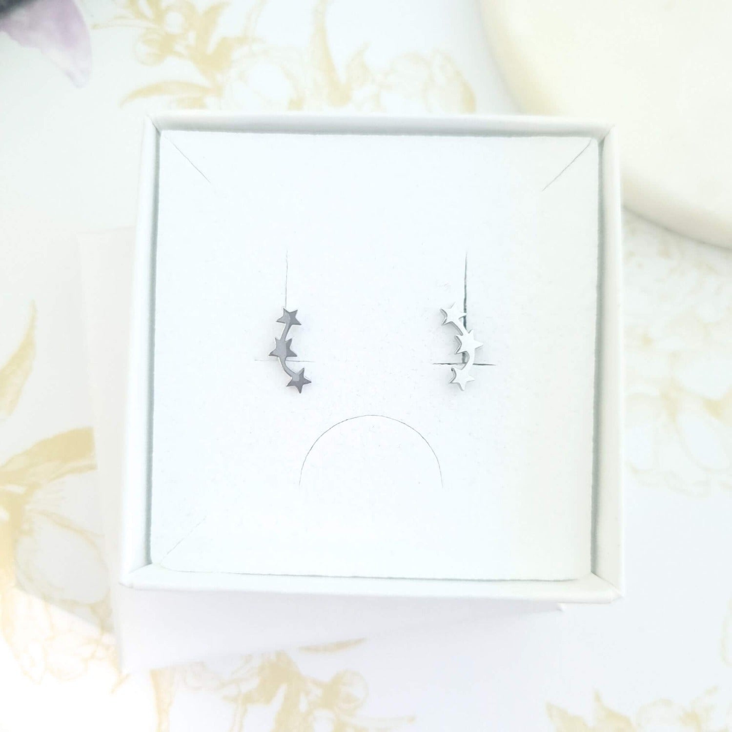minimalist star trio stud earrings in a gift box