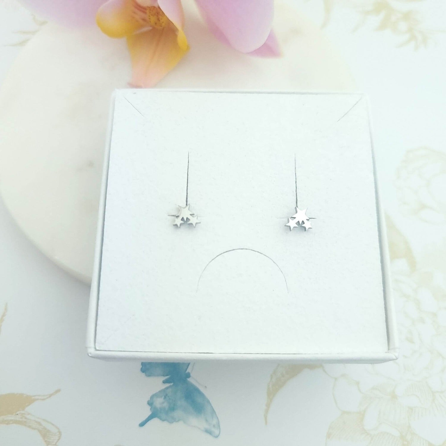 tiny trio of stars stud earrings in a gift box