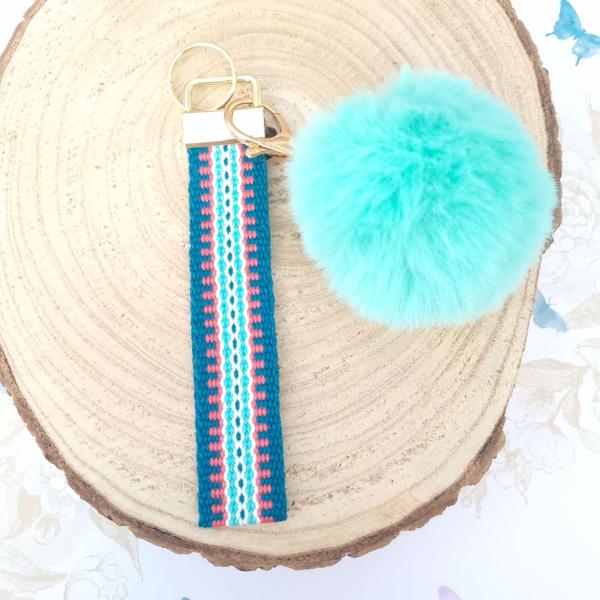 handwoven bracelet keychain with light green pom pom
