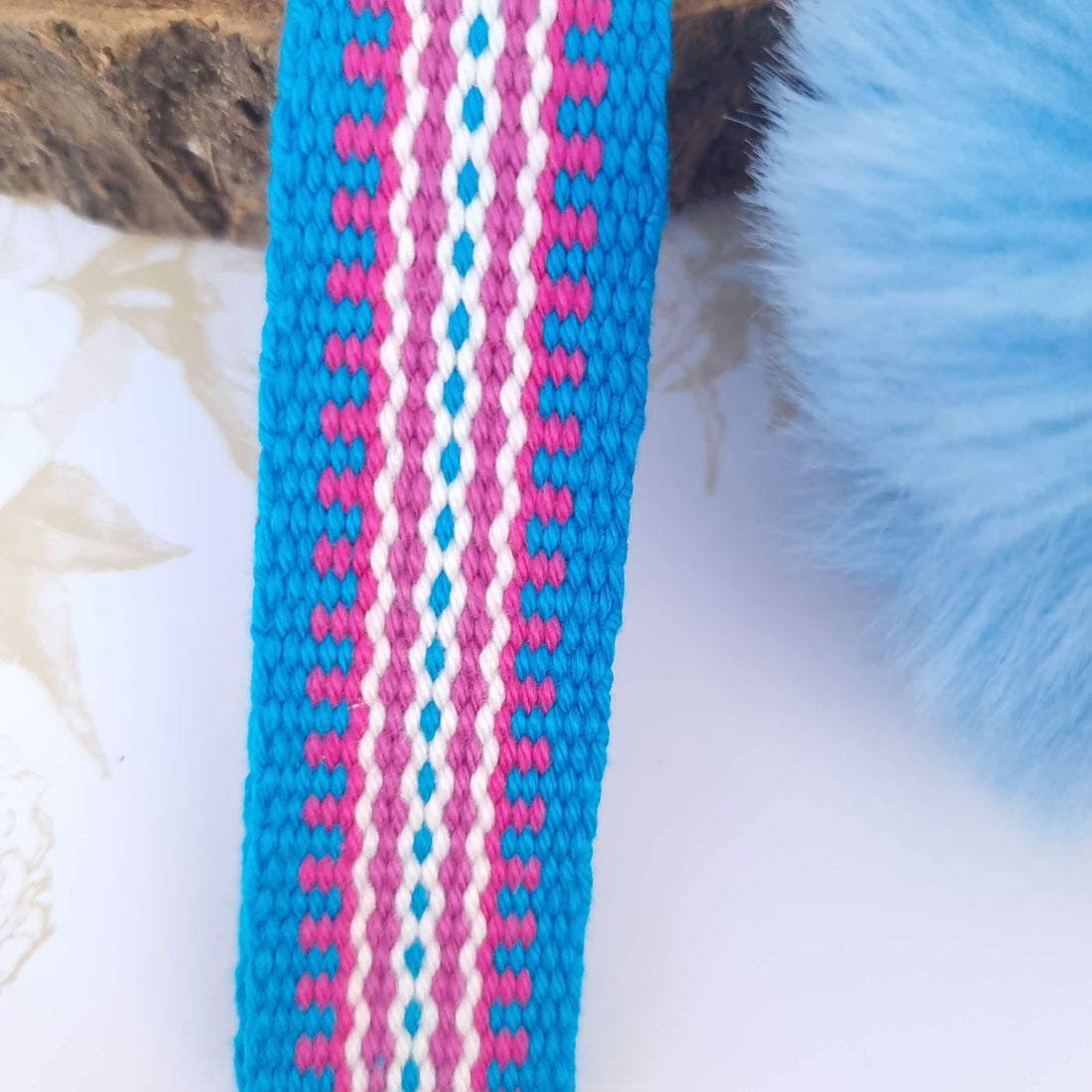 wrist lanyard in blue and pink with pompom