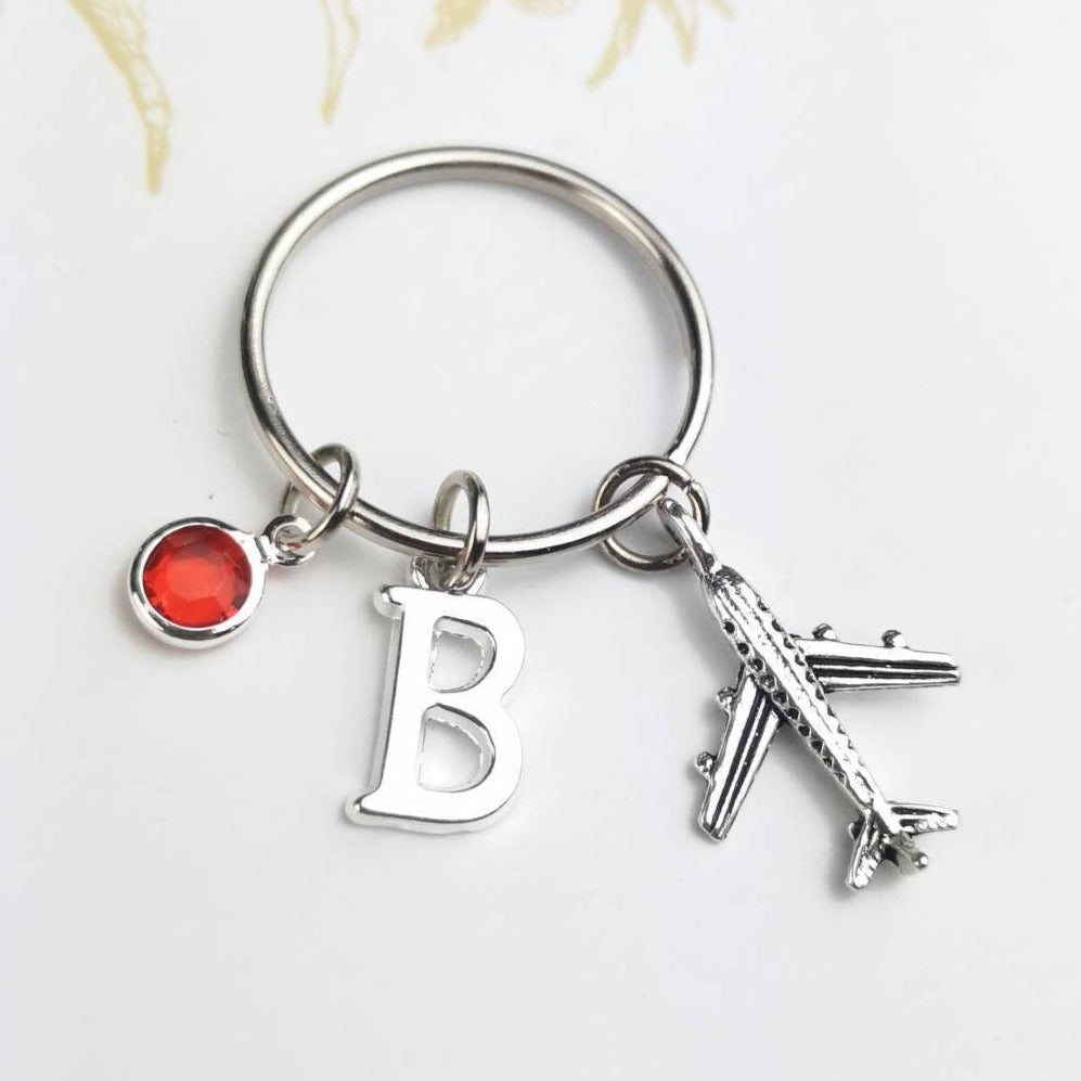 Personalised key ring with airplane, initial and birthstone