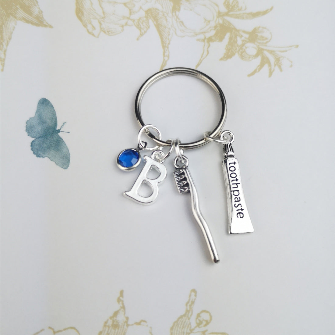 Personalised keyring with toothpaste and toothbrush charms