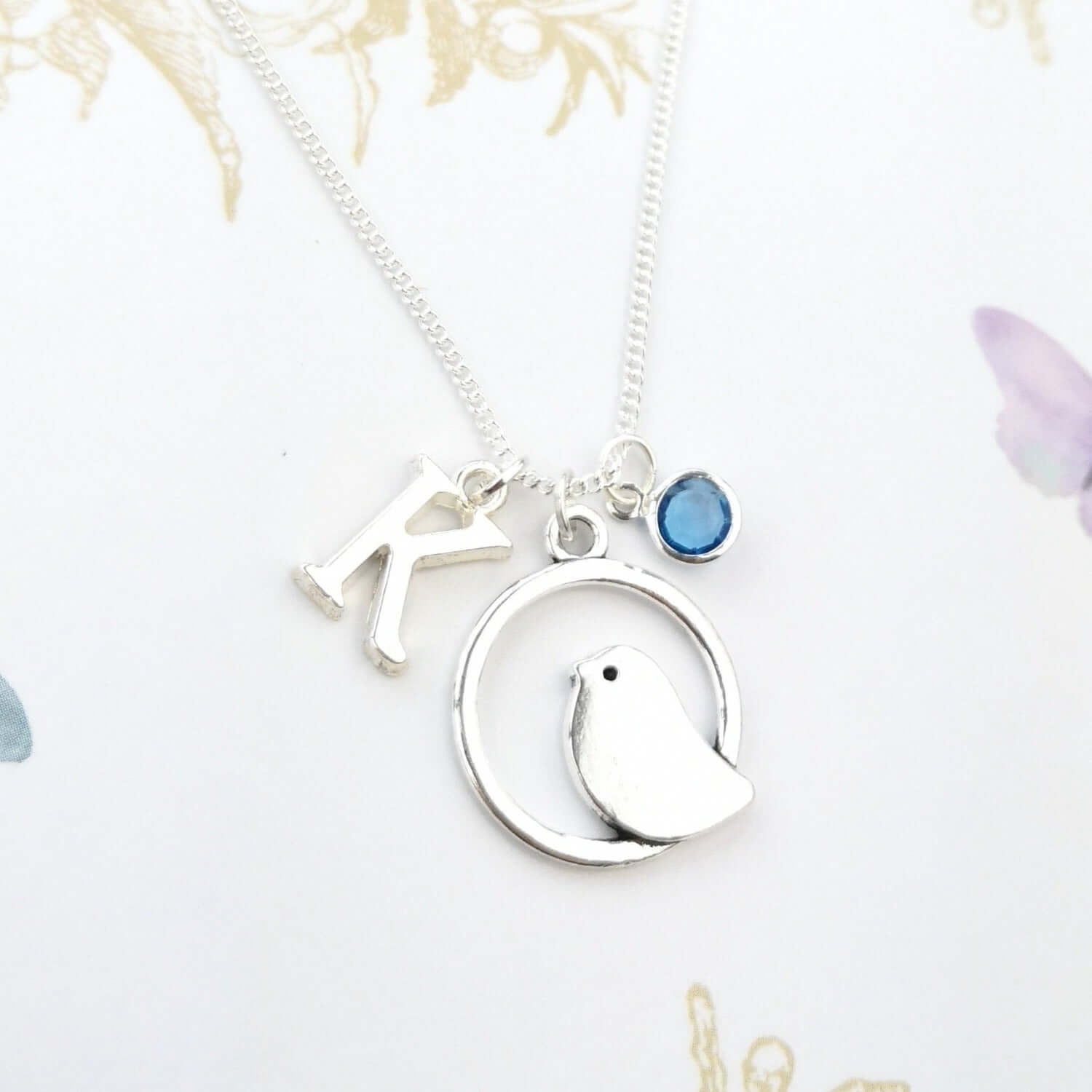 Personalised bird necklace with initial and birthstone
