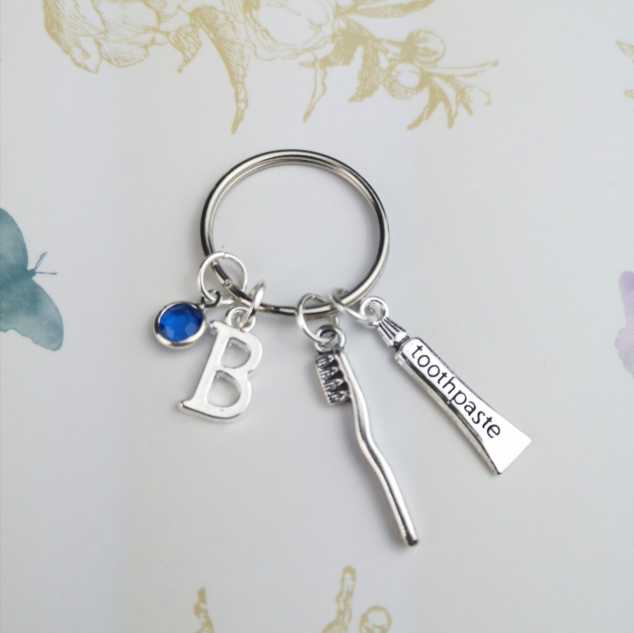 Personalised keyring with toothpaste and toothbrush charms