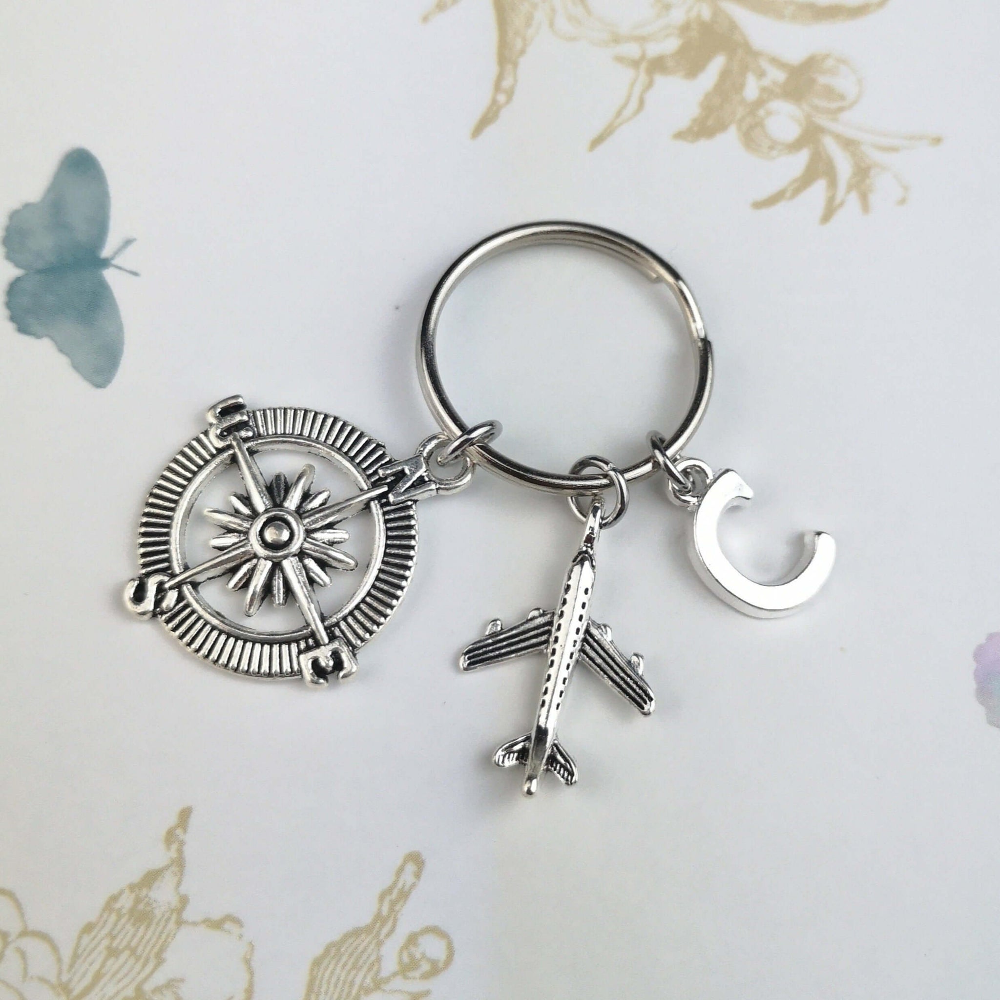 Personalised compass and airplane keyring