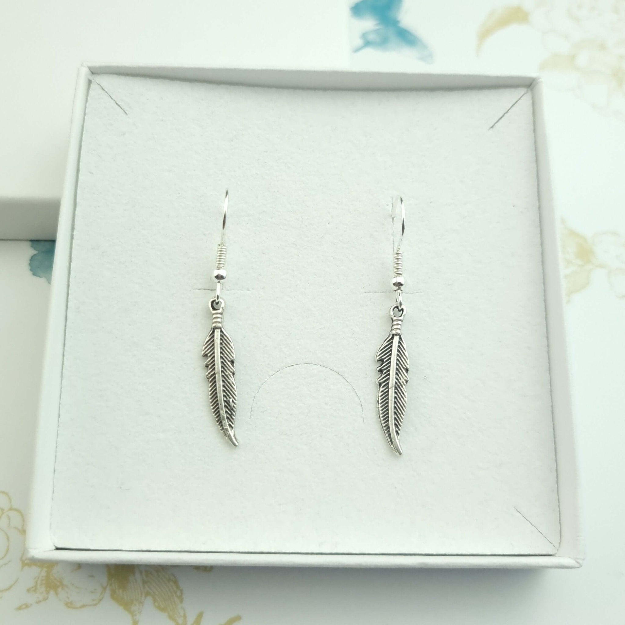 feather dangle drop silver earrings