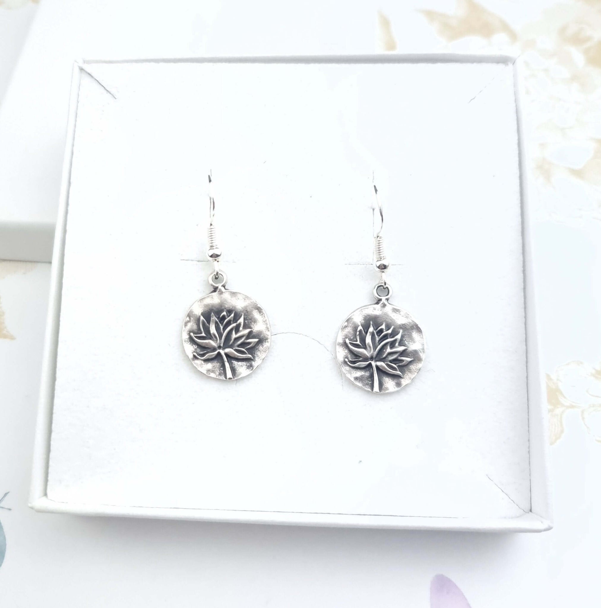 Drop dangle lotus earrings in a gift box