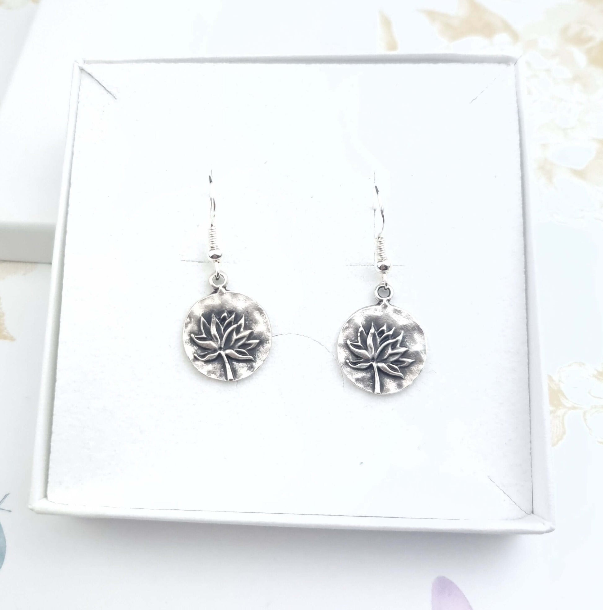 Drop dangle lotus earrings in a gift box