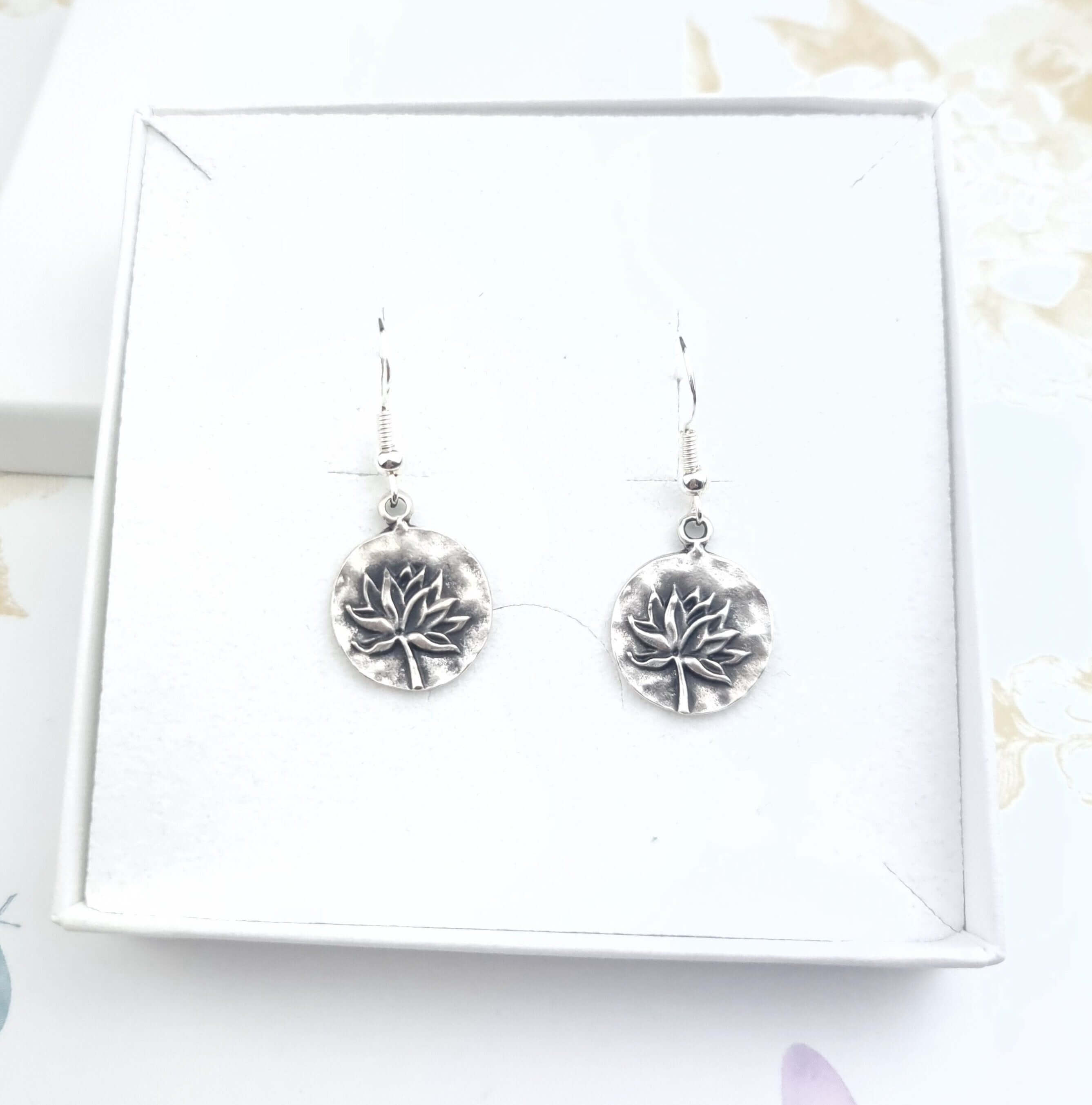 Drop dangle lotus earrings in a gift box