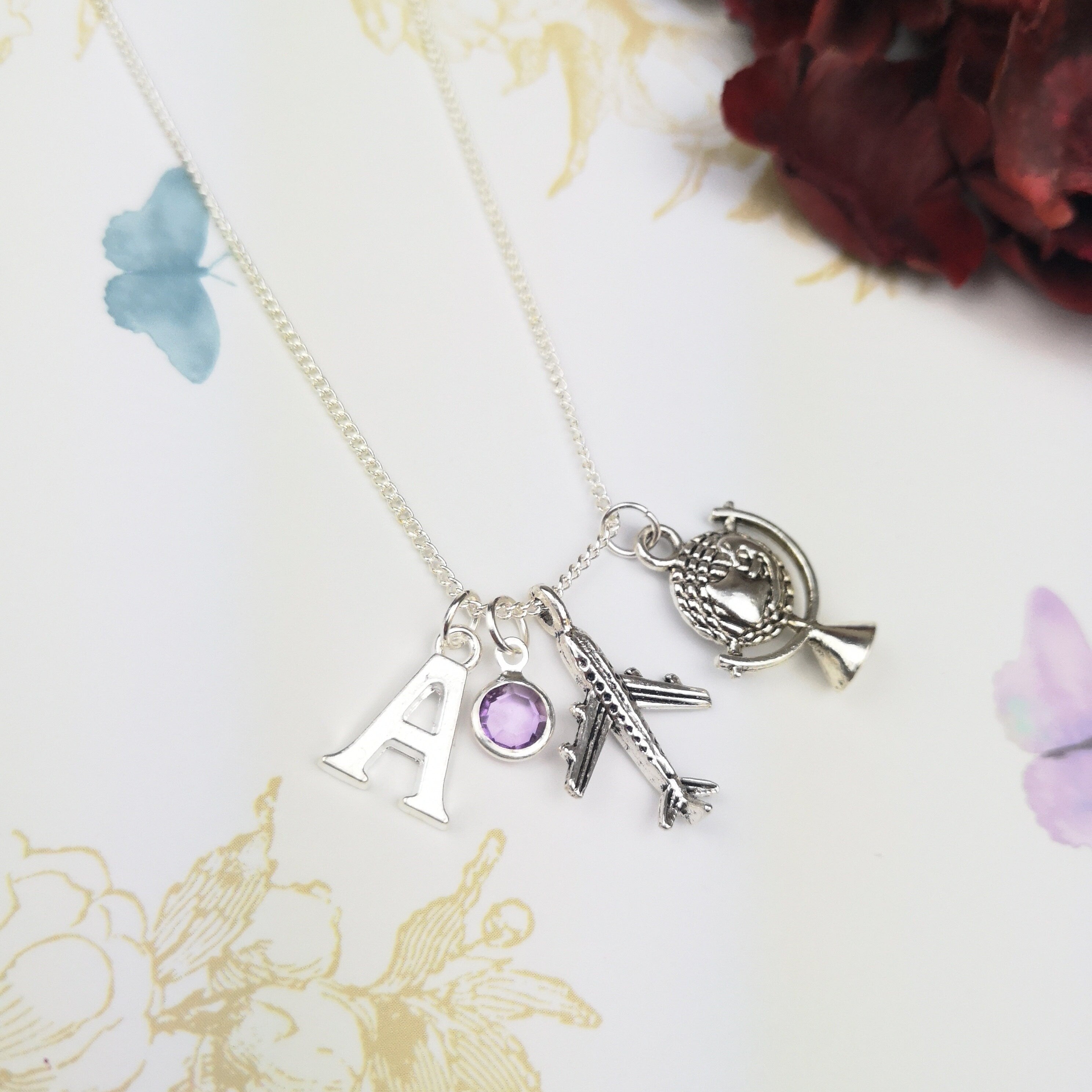 personalised aeroplane silver necklace with initial and birthstone
